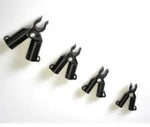 Set of black metal clamps on a white background