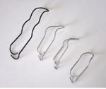 Set of metal clips on a white background